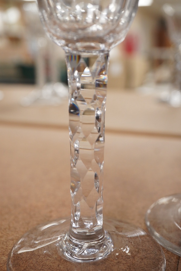 A pair of late 18th century wine glasses with faceted stems, 15cm high